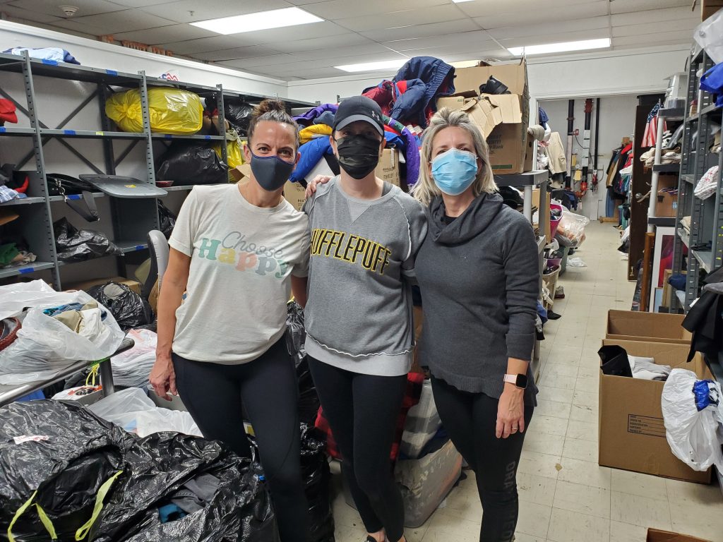 Sisters Jen and Carolyn - along with friend, Jen - volunteer in HVAF's basement once per week.